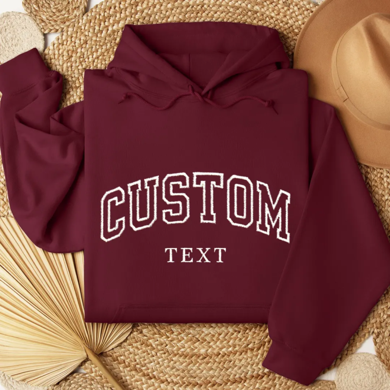 magenta colored hoodie with custom text on it